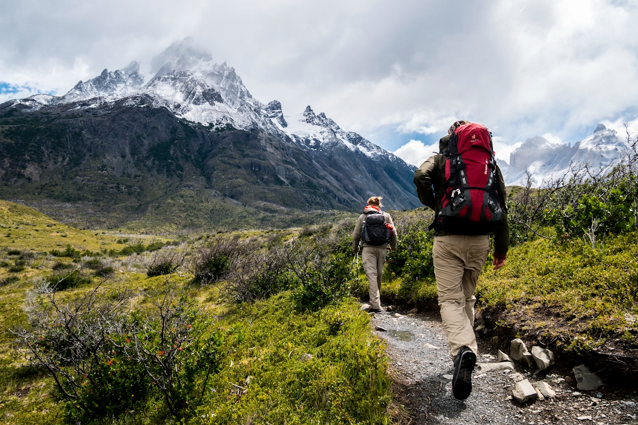 Hiker with a backpack on a mountain trail